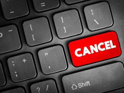 Computer keyboard with a red “Cancel” key.