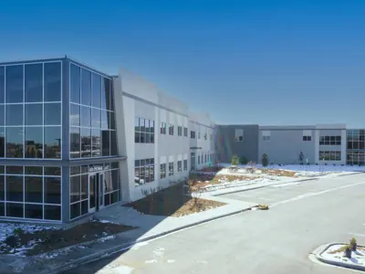 A corporate building and parking lot.
