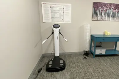 Body composition assessment equipment in a private consultation room.